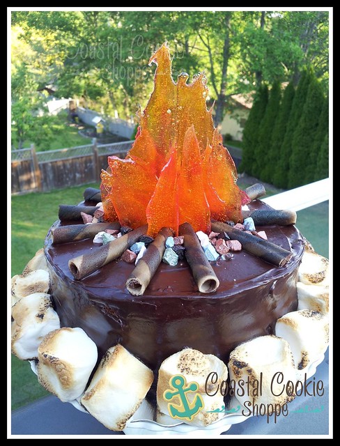 Camp Fire cake with candy flames and edible chocolate pebbles.