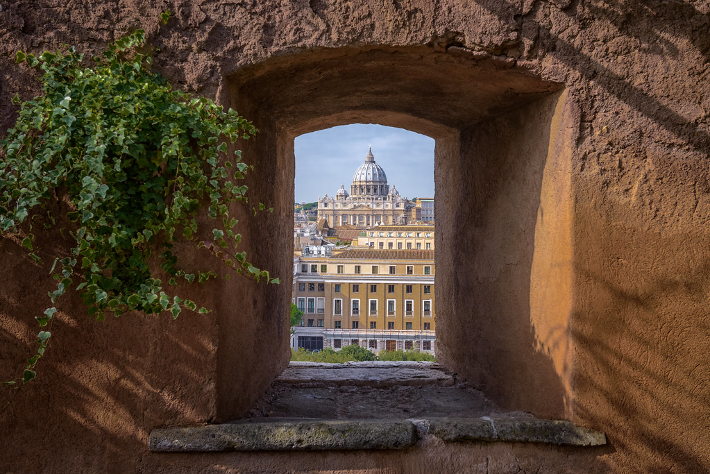 St. Peter's Basilica seen through an archway at Castel Sant'Angelo, Rome, Italy