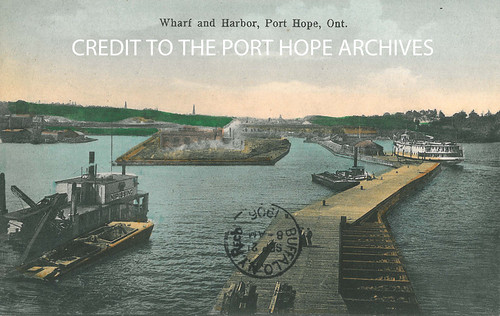 Port Hope Harbour Postcard by Port Hope Archives, Title:  Wharf and Harbor, Port Hope, Ont.

Accession #:  2013-34-3-4985

Description:  Colour postca