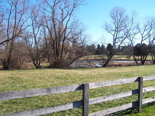 Farm field next to water in a rural setting