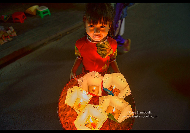 Candle lantern vendor for full moon festival in old town Hoi An, Vietnam