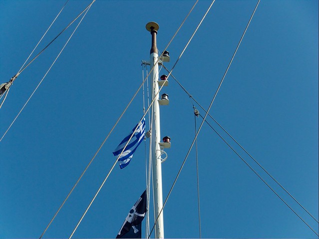 Mast of a tourist cruise vessel anchored at the norther port of Volcano (Santorini, Greece)