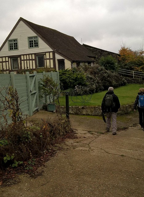 Walkers pass a house in Sussex 