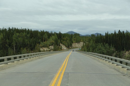 canada yukon territory highway landscape scenery lake mountains road forest nature