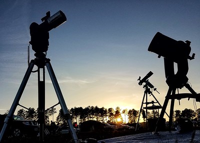 photo of telescopes at dusk