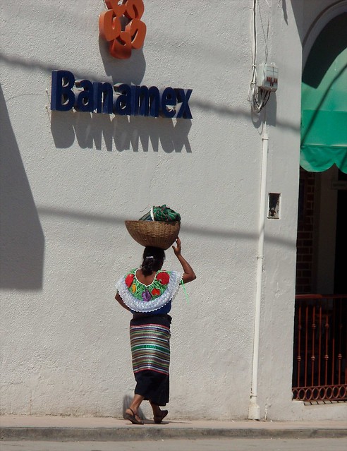 Tzeltal woman carrying basket by the bank; Ocosingo, Chiapas, Mexico