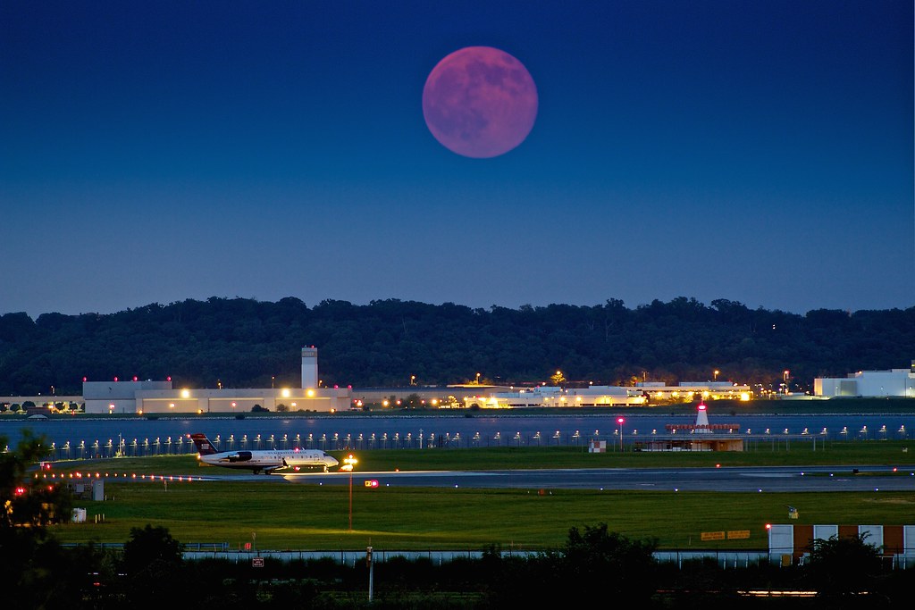 The "Super Moon" rises over Reagan National Airport. Photo by Joseph Gruber; (CC BY-NC-ND 2.0)