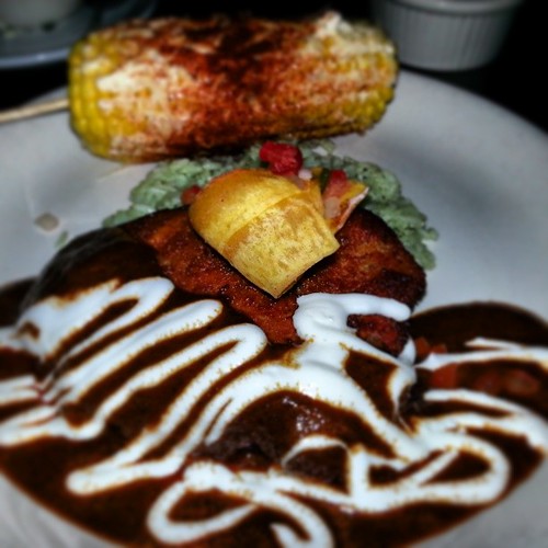 Plantation encrusted chicken with a mole sauce, tomatillo rice, and Mexican street corn. Totally delicious.