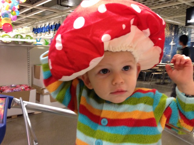 Zoe trying on hats at IKEA