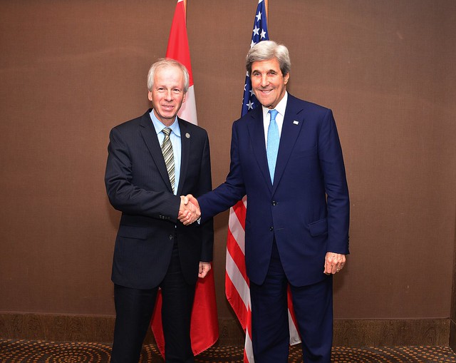 Secretary Kerry and Canadian Foreign Minister Dion Shake Hands at APEC Summit