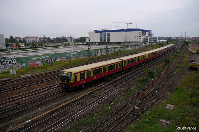 An S-Bahn train passing the O2 World stadium