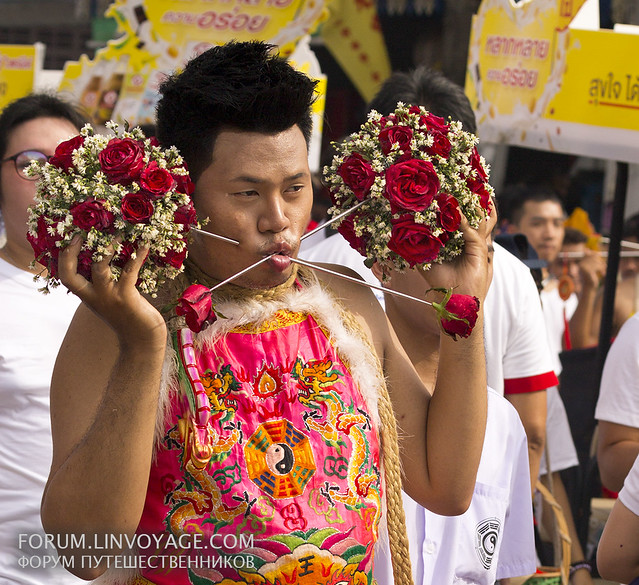 Flowers to you! Street procession. Phuket Vegetarian Festival. October, 2016. Phuket, Thailand