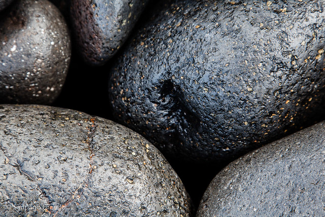 Black volcanic boulders