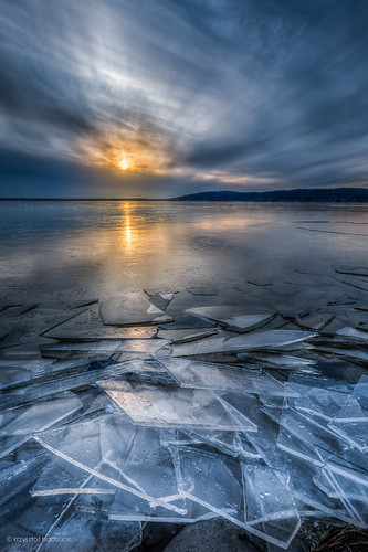 sunset sun lake ice water wisconsin clouds frozen unitedstates iceberg wi lakegeneva hanusiak
