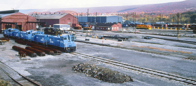 Conrail EMD switchers and other locomotives seen in the Juniata Lovomotive Shop & yard area at Altoona, Pennsylvania, October 1994