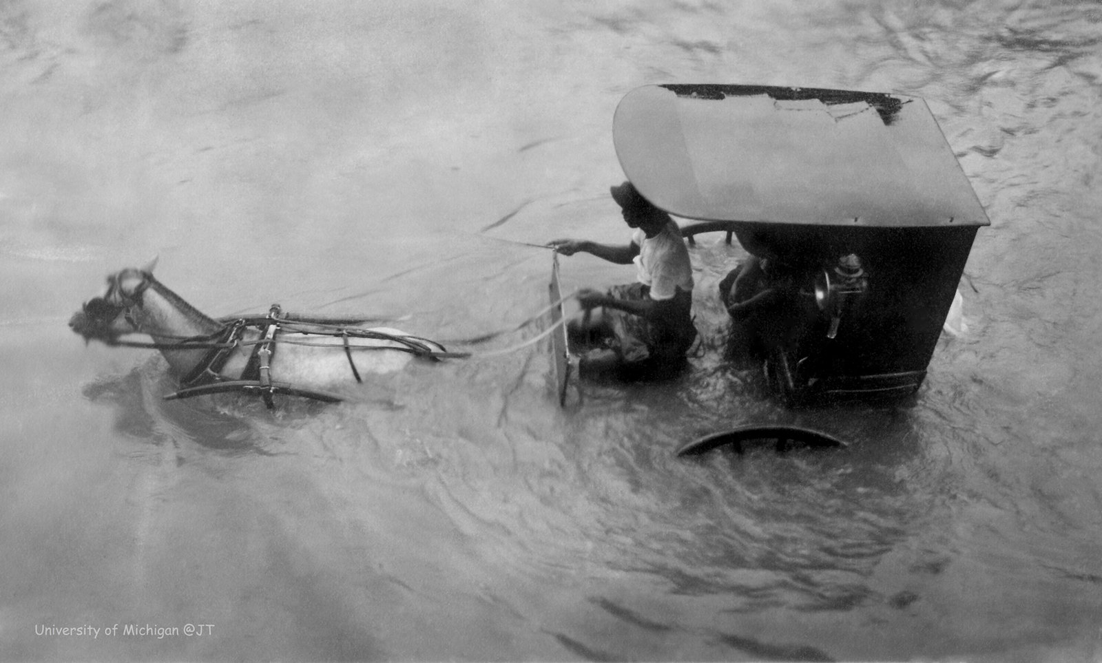 Carromata being driven in high water, Manila Philippines, 1910-1915