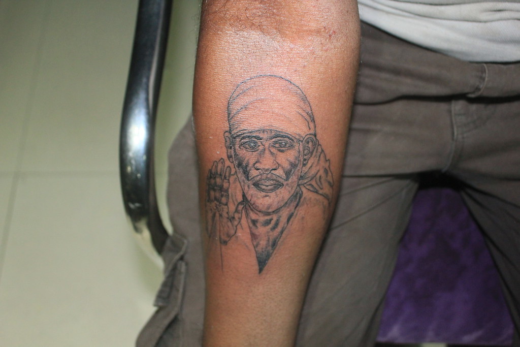 Sai baba portrait tattoo on interior forearm  Dev Tattoo Studio Ratlam   Jhaiho
