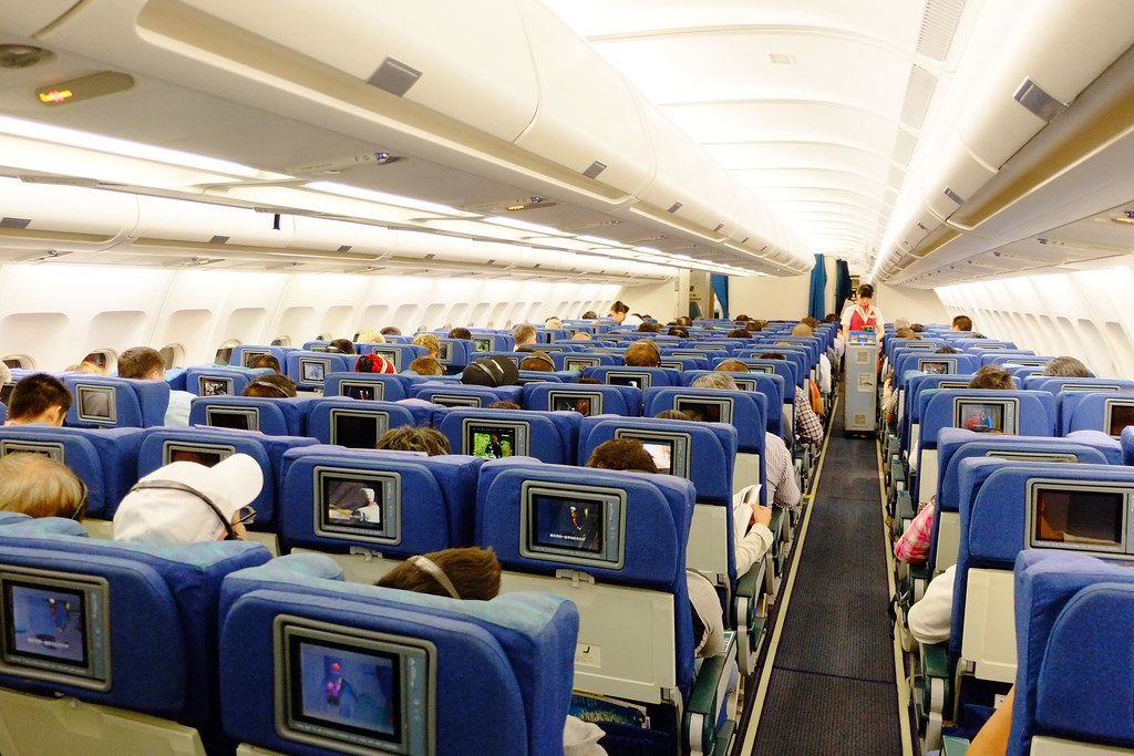 The Economy Class Cabin Of A Cathay Pacific Airways Airbus