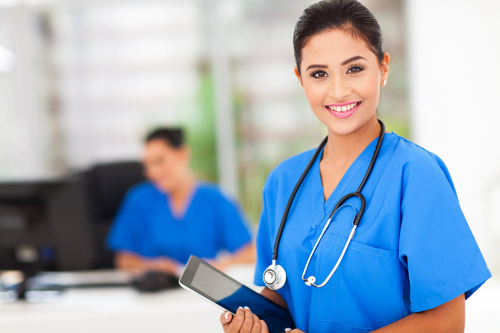 Female nurse | attractive young female nurse holding tablet … | Flickr