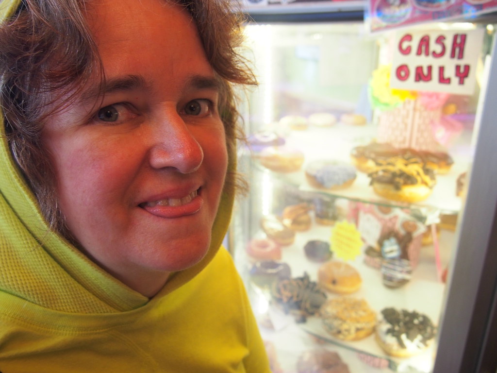Lisa likes the Voodoo Doughnut display | OLYMPUS DIGITAL CAM… | Flickr