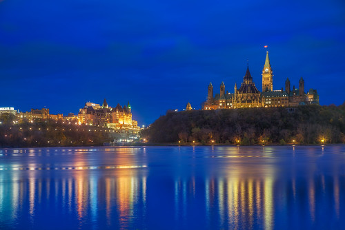 ca city travel vacation sky holiday canada reflection clock water night america landscape lights flag ottawa parliament canadian clear québec gatineau northamerica bluehour