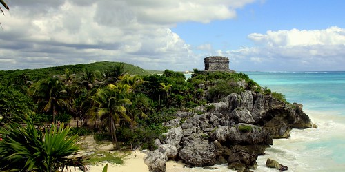 konomark tulum mayan ruin caribbean ocean sunny blue sky sea shore beach front view cloud qroo quintana roo mx mexico archaeology archaeological site ancient temple structure
