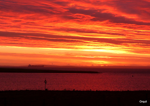 shepherdswarning very red november dawn skyscape cloudscape layered clouds golden sunlight spectacular sky navionanglia large ship crudeoil tanker anchored silhouette seaside calm sea scapaflow natural anchorage houton bay leadinglight verydark shadows field fenceline westmainland autumn sunrise earlymorning orkney islands scotland uk unitedkingdom greatbritain orcades great memorable dramatic interesting stunning