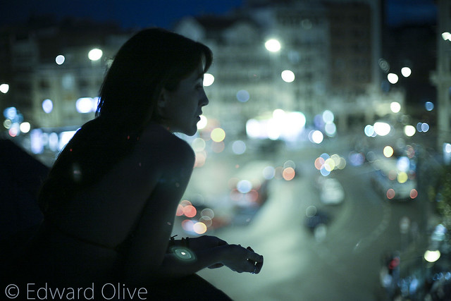 Silhouette of young woman in city at night ©  Edward Olive portraiture from Madrid Spain