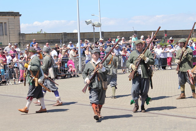 Musketeers moving to demonstrate musket loading