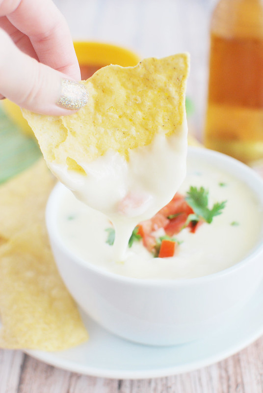 Restaurant Style Queso Dip - just like your favorite Mexican restaurant! Spicy melted cheese - perfect for dipping tortilla chips or using as a topping for tacos or burritos!