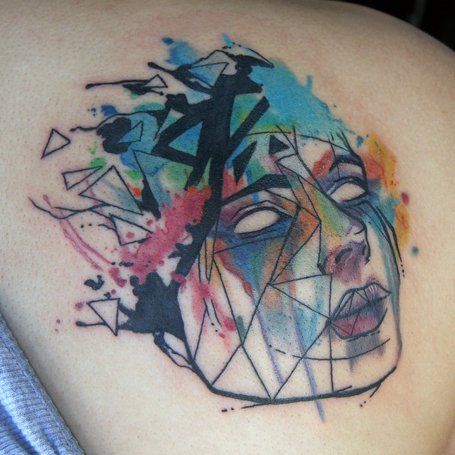 abstract watercolor face tattoo