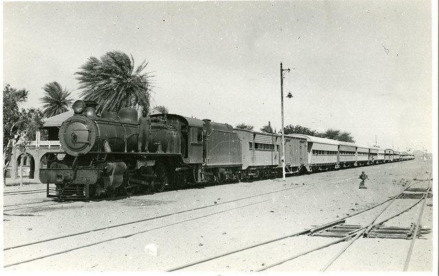 Sudan Railways - War Department (Middle East Forces) 4-6-2 steam locomotive Nr. 2807 with a Wadi Halfa to Khartoum troop train at Abu Hamid, Sudan, in 1946