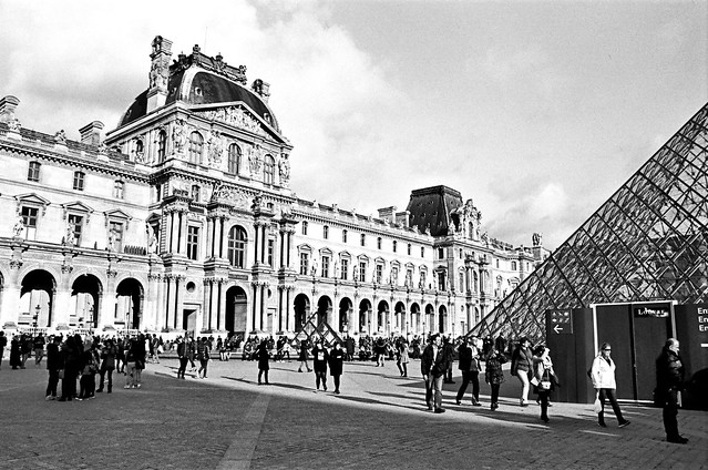 The Louvre with Pyramid and Tourists