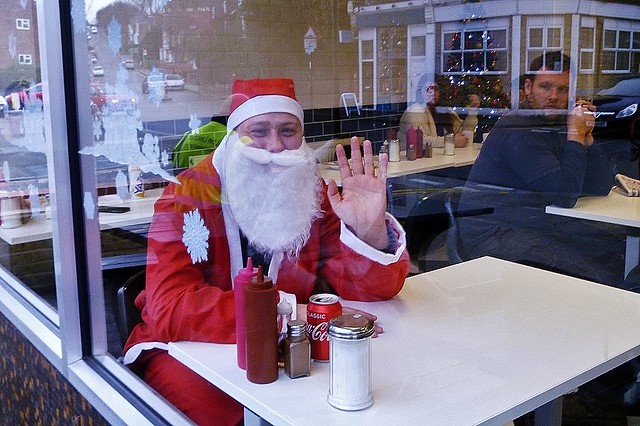 Santa has a refreshing coke between deliveries