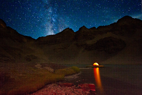 light camp orange lake mountains reflection stars landscape milkyway
