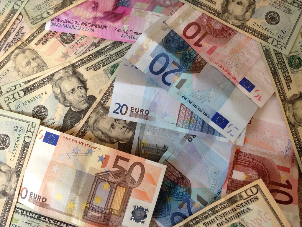 US dollars and Euros - cash banknotes | A stock photo of dol… | Flickr