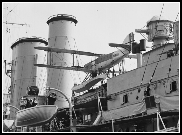 HMS York in USA. Note ships aircraft, a Fairey Seafox.