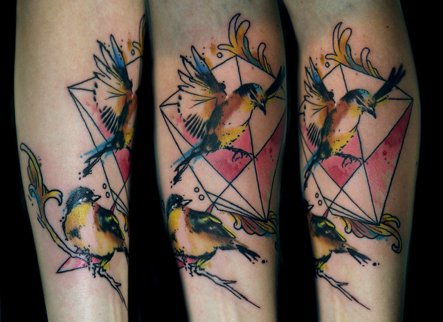 geometric watercolor bird tattoo