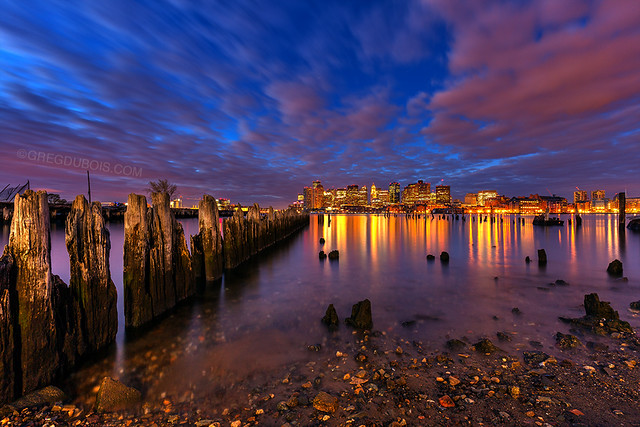 Carlton's Wharf East Boston, Downtown Boston Skyline Reflecting on Boston Harbor at Dawn with Decayed Pilings and Clouds
