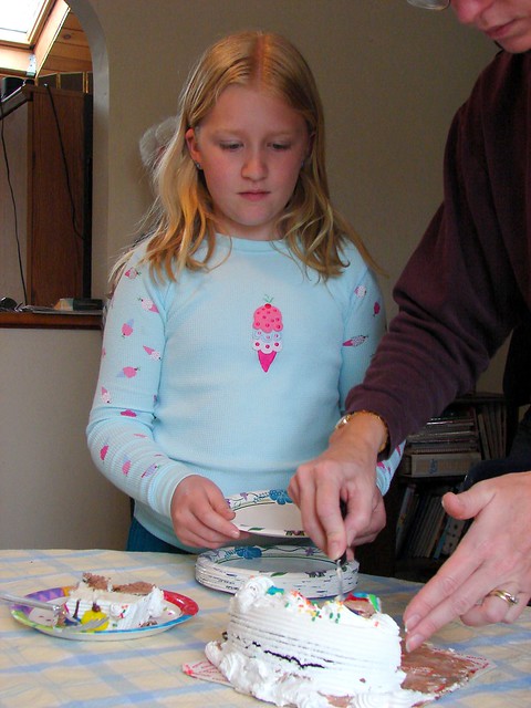 Zoe serves the cake