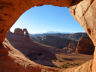Delicate Arch and the La Sals seen through Frame Arch