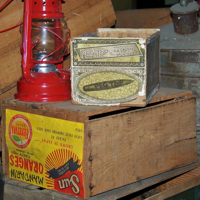 Cigar box, fruit crate, lantern