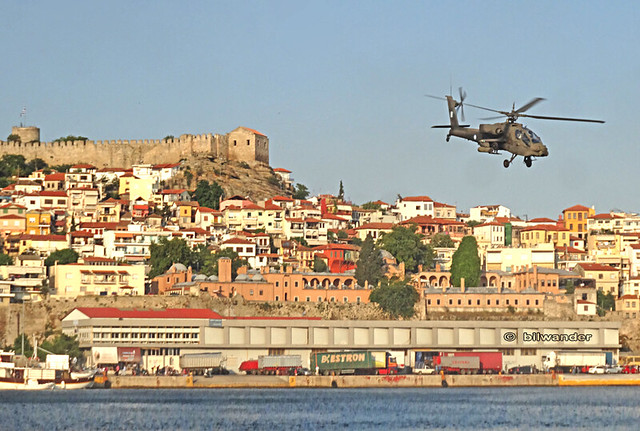 Greece, Macedonia  Kavala airshow,  Hellenic Αirforce apache helicopter at low-pass over the harbor