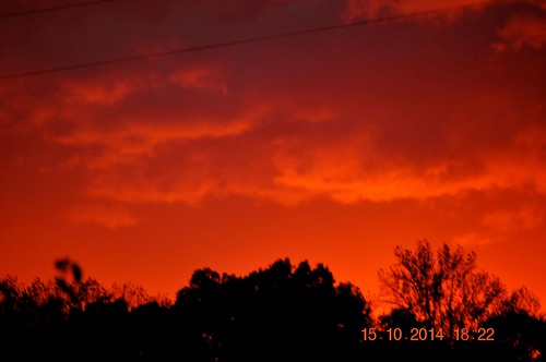 red sun clouds setting