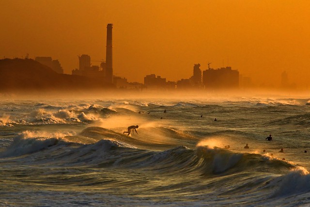 Surfers in the rough sea - Tel-Aviv beach