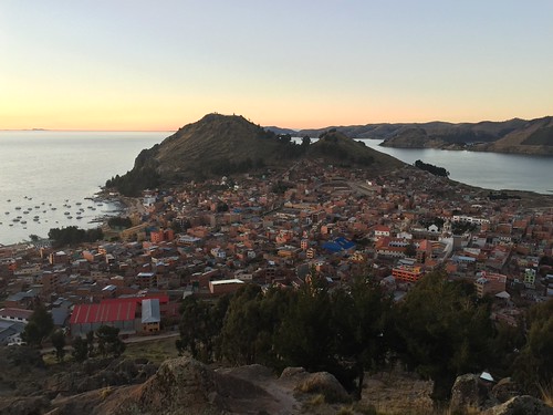 View over Copacabana from Horca del Inca at sunset by fiftybybike,