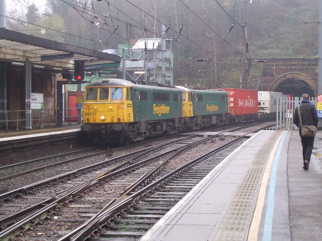 86 607 with a classmate haul a fully loaded Container Train into Ipswich Station.