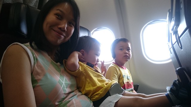 Liam and Isaac with mummy on the Qantas flight to Singapore