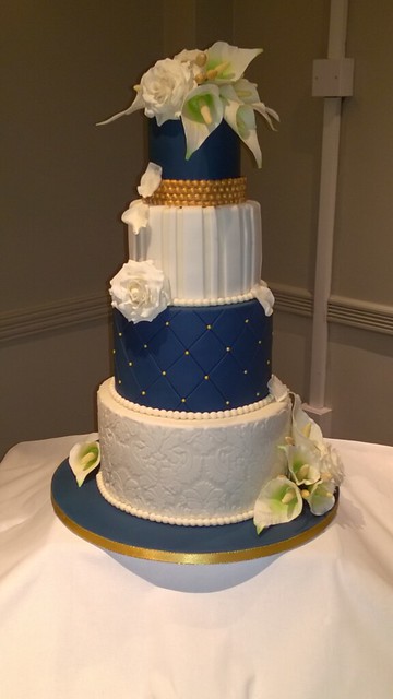 Navy, ivory & gold wedding cake with handmade sugar flowers