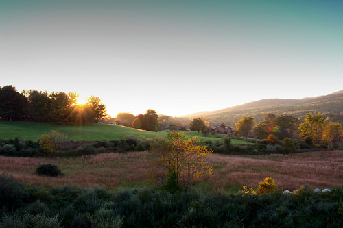 sunset sunburst field mountains sky hay trees color fall autumn